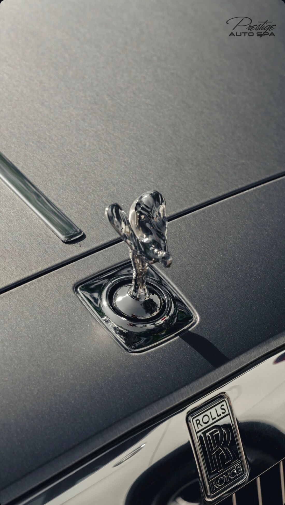Spirit of Ecstasy hood ornament on a Rolls-Royce, with the bonnet paint spotless